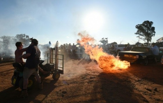 A modified pick-up truck fires flames from its exhaust pipes before a «Bachelor and Spinster» ball in the town of Ariah Park in western New South Wales