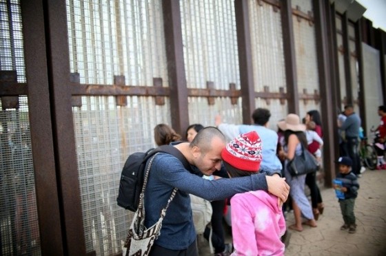 Six families passed through a gate in the US-Mexico border fence to greet relatives in an event organized by advocacy group Border Angels with US authorities to mark UN Children's Day