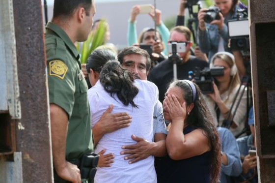 For three minutes, under the watchful eye of border agents and a scrum of journalists, a few chosen ppeople are able to hug loved ones on the US-Mexican border