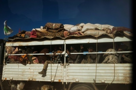 Militia from Iraq's Hashd Al Shaabi (Popular Mobilisation Units) on a truck on their way to Tal Afar airport