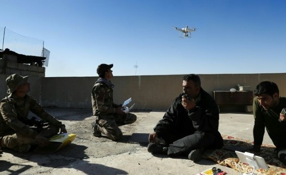 Iraqi government forces as well as Islamic State (IS) group jihadists already use drones for reconnaissance mission, such as these government forces looking for IS fighters hiding themselves in Mosul as they secure the area on November 22, 2016