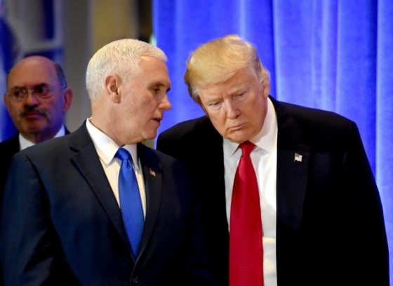 US President-elect Donald Trump (R) and Vice President-elect Mike Pence talk during press conference on January 11, 2017 at Trump Tower in New York