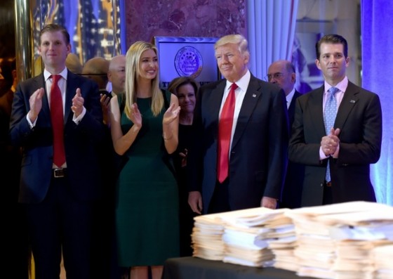 US President-elect Donald Trump along with his children (L-R) Eric, Ivanka and Donald Jr. arrive for a press conference on January 11, 2017 at Trump Tower in New York