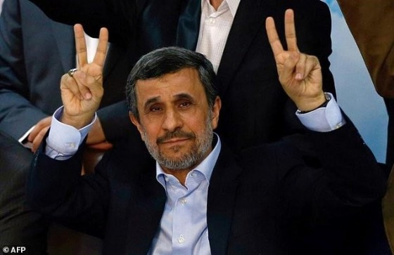 Former Iranian president Mahmoud Ahmadinejad flashes the sign for victory at the Interior Ministry's election headquarters as candidates begin to sign up for the upcoming presidential elections in Tehran on April 12, 2017