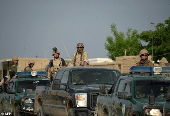 Afghan security personnel arrive at the site of an ongoing attack on an army compound in Dihdadi District of Balkh province on April 21, 2017