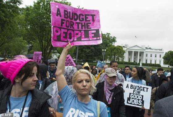 Protestors rally against US President Donald Trump's budget and agenda at Lafayette Park outside the White House on April 25, 2017