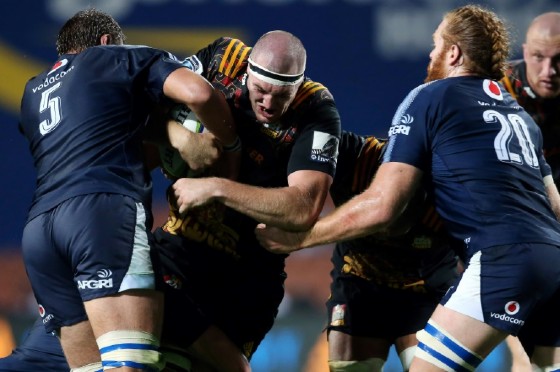 The Waikato Chiefs' Brodie Retallick (C) is tackled by the Northern Bulls' Lood De Jager (L) and Jannes Kirsten during their Super Rugby match, at FMG Stadium in Hamilton, on April 1, 2017
