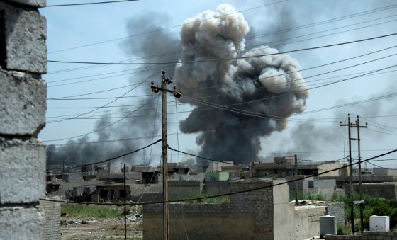 Smoke billows after a reported air strike on the northwestern Al-Haramat neighbourhood of Mosul on May 9, 2017