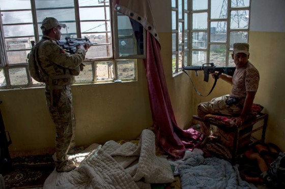 Members of the Iraqi forces guard a position in the northwestern al-Haramat neighbourhood of Mosul on May 9, 2017