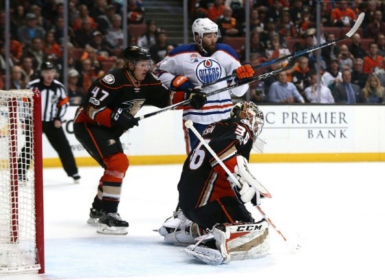 Goaltender John Gibson and Hampus Lindholm of the Anaheim Ducks defend against Patrick Maroon of the Edmonton Oilers in Game Seven of the Western Conference Second Round