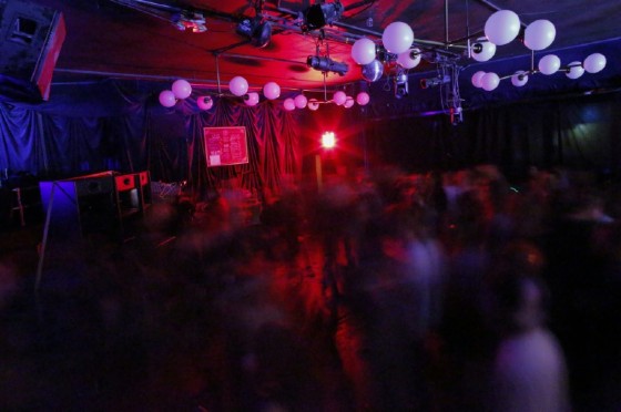 People dance during a Lights Out concert at The Knitting Factory in Brooklyn New York on May 12, 2017