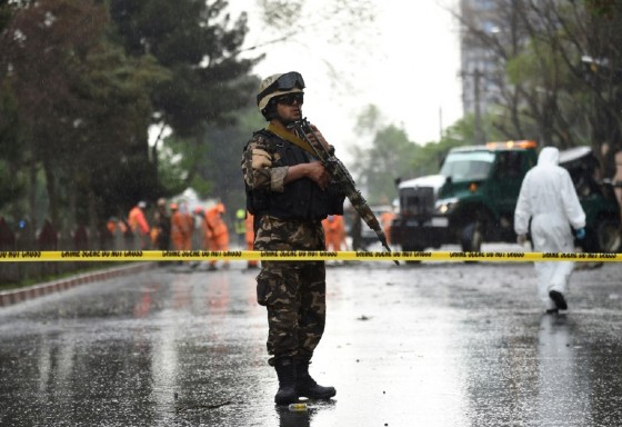 An Afghan soldier stands guard at the site of a suicide attack that targeted a foreign forces convoy near the US embassy in Kabul