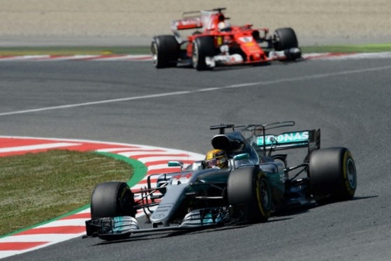 Mercedes' British driver Lewis Hamilton (bottom) and Ferrari's German driver Sebastian Vettel drive at the Circuit de Catalunya on May 14, 2017 in Montmelo on the outskirts of Barcelona during the Spanish Formula One Grand Prix