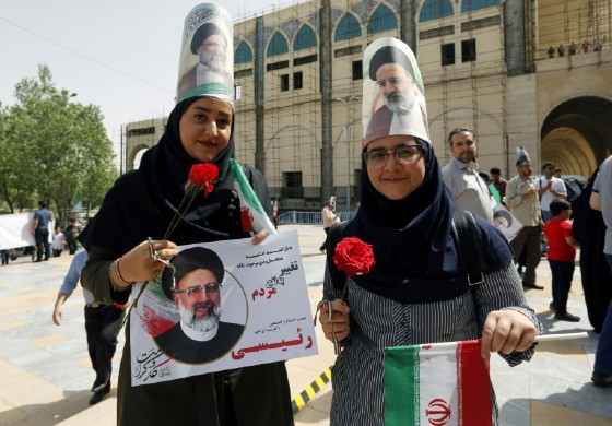 Supporters of presidential candidate Ebrahim Raisi outside a campaign rally in Tehran on May 16, 2017. Raisi has promised to triple cash hand-outs to the poor, hoping to pick up voters that once supported hardline populist Mahmoud Ahmadinejad