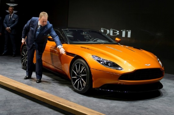 Aston Martin CEO Andy Palmer shows the new DB11 model car during the press day of the Geneva Motor Show on March 1, 2016