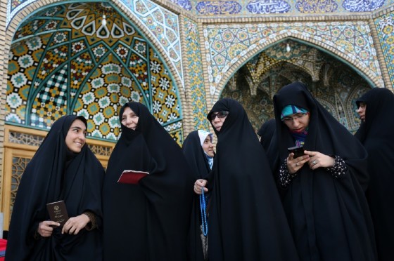 Women prepare to vote in Iran's presidential election in the Shiite Muslim holy city of Qom on May 19, 2017