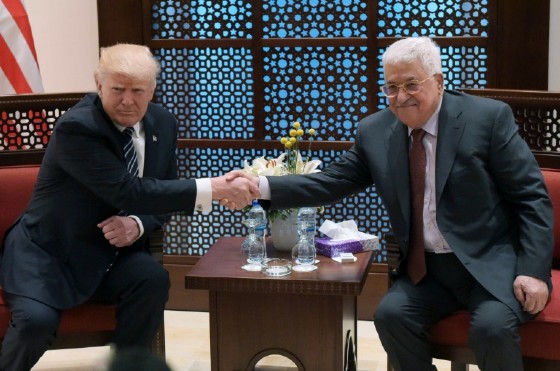 US President Donald Trump (L) shakes hands with Palestinian leader Mahmud Abbas during a meeting in the West Bank city of Bethlehem on May 23, 2017