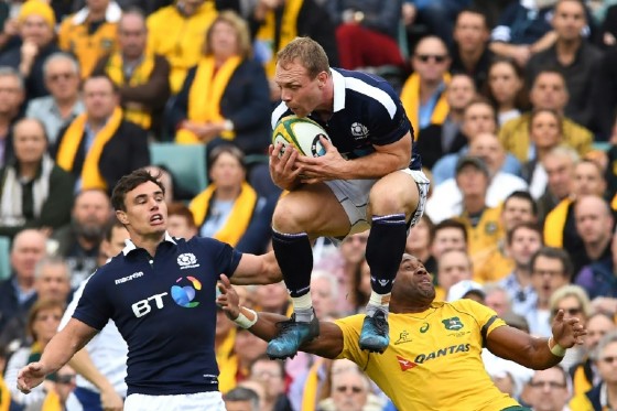 Scotland's Greig Tonks (C) grabs the ball in front of teammate Lee Jones and Australia's Tevita Kuridrani during their rugby union Test match in Sydney, on June 17, 2017