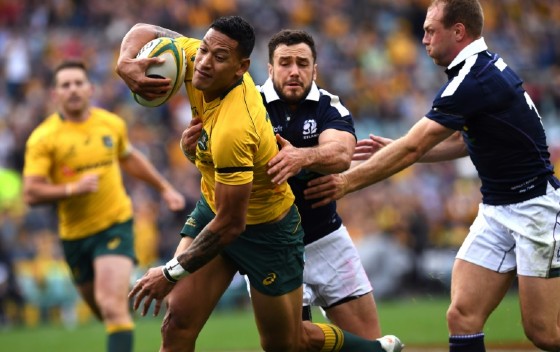 Australian Wallabies' Israel Folau powers to the line to score a try during their rugby union Test match against Scotland, in Sydney, on June 17, 2017