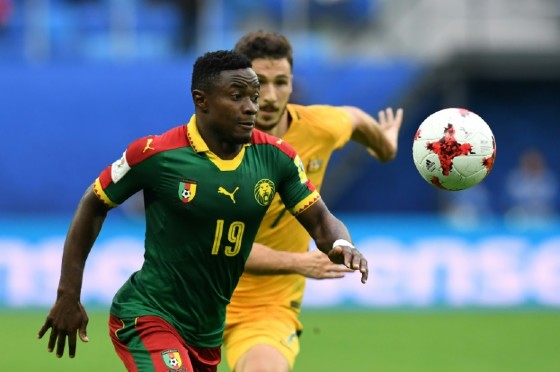 Cameroon's defender Collins Fai (L) fights for the ball against Australia's forward Mathew Leckie during the 2017 Confederations Cup group B football match against Australia at the Saint Petersburg Stadium on June 22, 2017