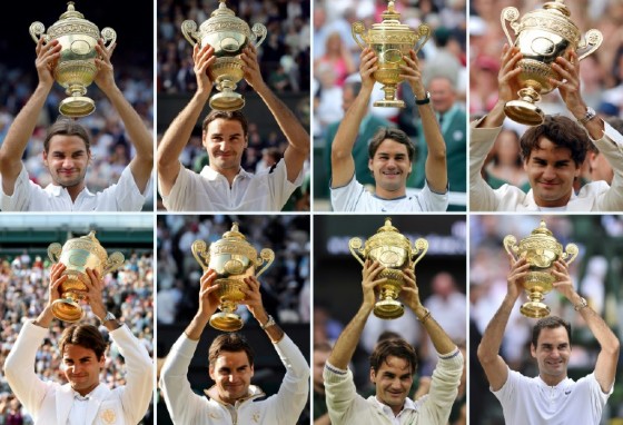 Switzerland’s Roger Federer holds up the Wimbledon Championships trophy after winning each of his eight men's singles titles