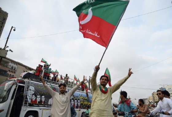 Supporters of opposition leader Imran Khan's Pakistan Tehreek-i-Insaf (PTI) celebrate after the Supreme Court decison against Pakistan's Prime Minister Nawaz Sharif near Khan's residence in Karachi