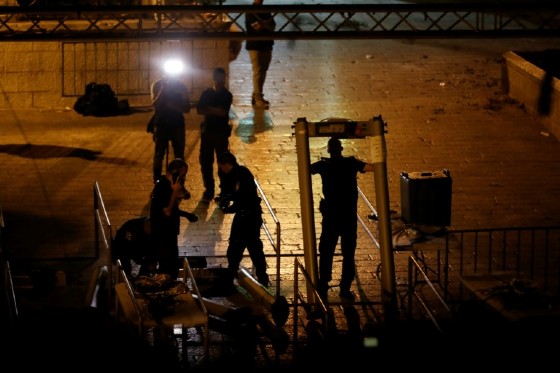 Israeli security forces remove metal detectors they had installed at the Lions' Gate entrance to Jerusalem's Al-Aqsa mosque compound on July 24, 2017