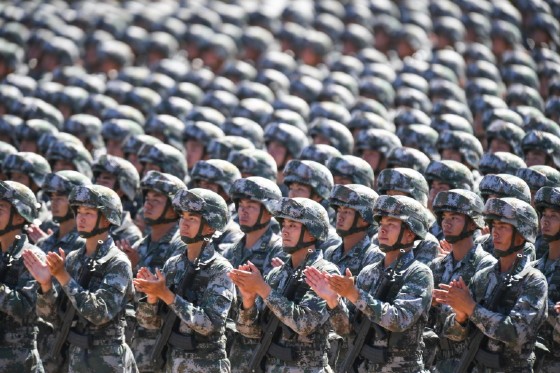 Soldiers applaud Xi during the parade