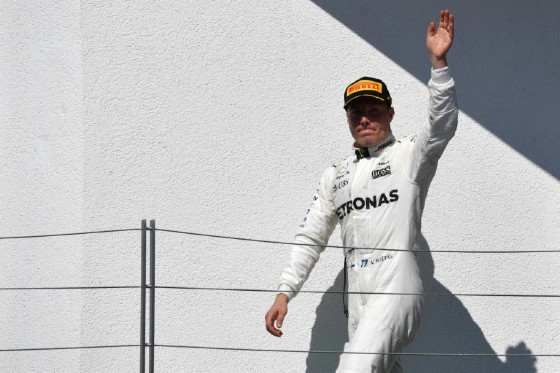 Mercedes driver Valtteri Bottas arrives on the podium following the Hungarian Grand Prix in Budapest on July 30, 2017.