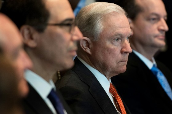 Attorney General Jeff Sessions, in a red tie, has been one of President Donald Trump's many targets in recent weeks