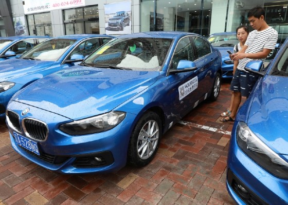 A company in the northeastern Chinese city of Shenyang is rolling out a first batch of royal blue BMWs for sharing -- where users scan a QR code with their mobile phones