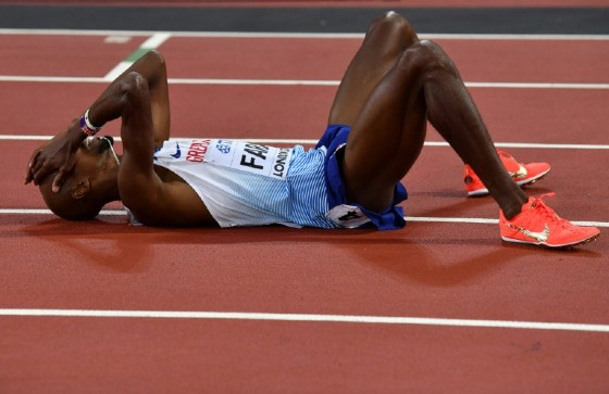 Britain's Mo Farah reacts after finishing second to take silver in the final of the men's 5000m athletics event at the 2017 IAAF World Championships at the London Stadium in London on August 12, 2017