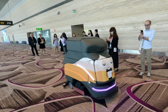 An automatic robot vacuum cleans the floor at Singapore's highly regarded Changi airport