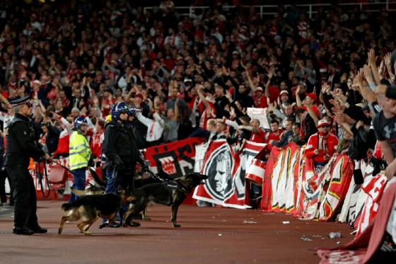 British police inside the Emirates Stadium keep an eye on Cologne supporters during their Europa League match against Arsenal