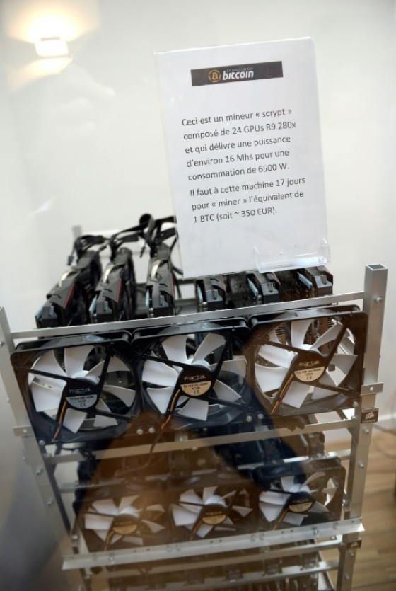 Cryptocurrency miners uses energy-intensive machines such as this seen at La Maison du Bitcoin in Paris but as the process becomes ever more complex ever more powerful and power-hungry computers are needed.