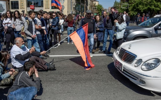Several hundred people sat or laid down on pavements, blocking roads leading to the parliament building and universities